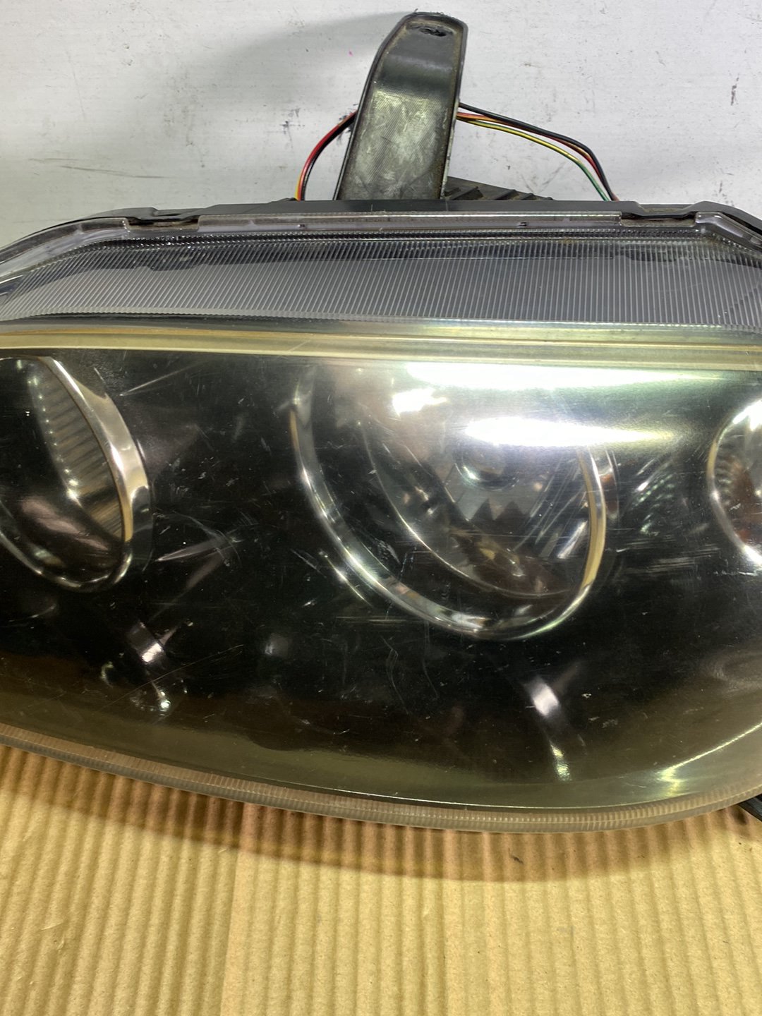 2005 Mazda Demio- Left Headlight PN: STANLEY P2632