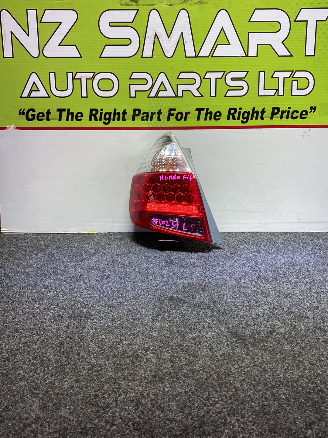 2005 Honda Fit - Left Taillight PN: ICHIKOH 4995