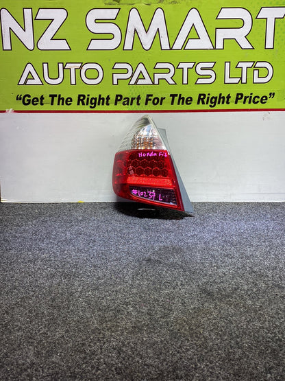 2005 Honda Fit - Left Taillight PN: ICHIKOH 4995