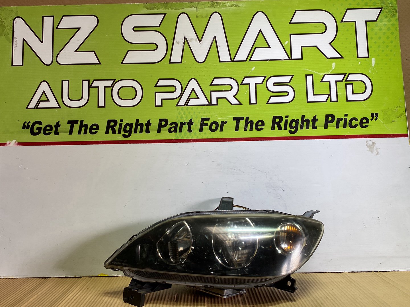 2005 Mazda Demio- Left Headlight PN: STANLEY P2632