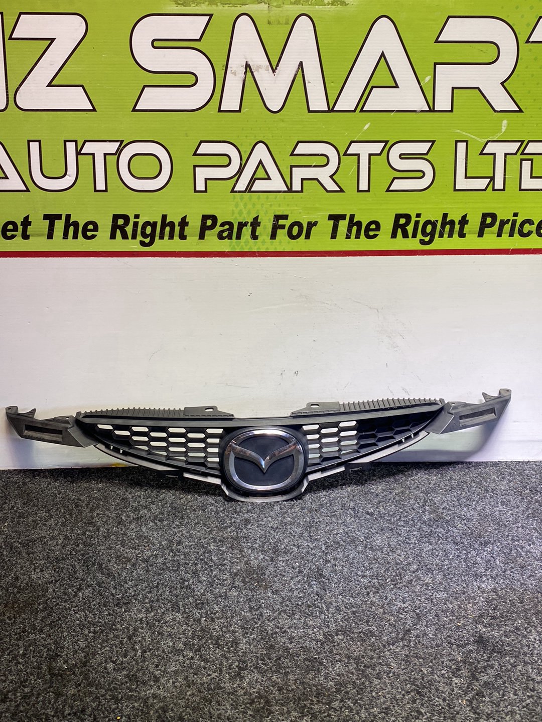 2010 Mazda Demio - Upper Bumper Grille PN: D65150710