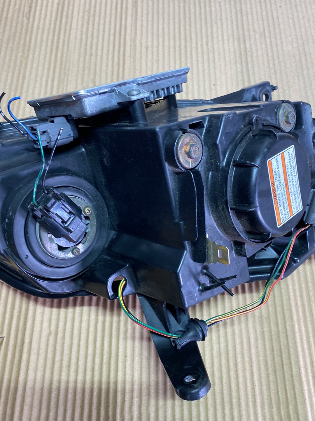 2005 Mazda Demio- Left Headlight PN: STANLEY P2632
