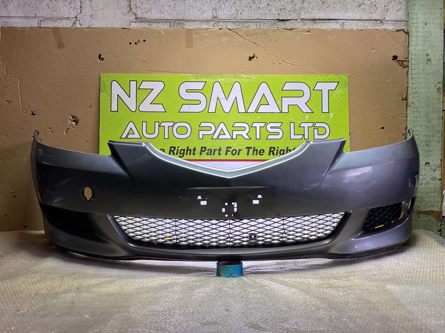 2005 Mazda Axela- Front Bumper PN: see photos