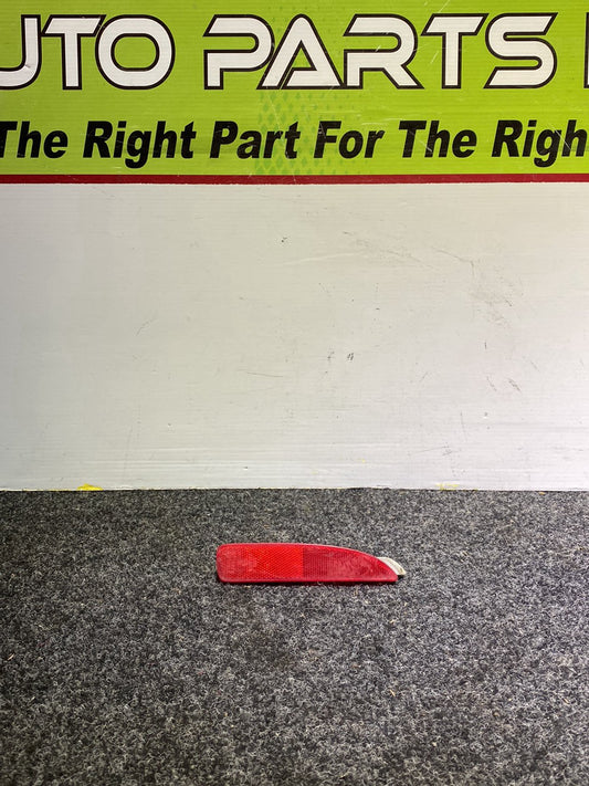 2006 Mazda Axela - Left Rear Bumper Reflector PN: STANLEY P2491 B