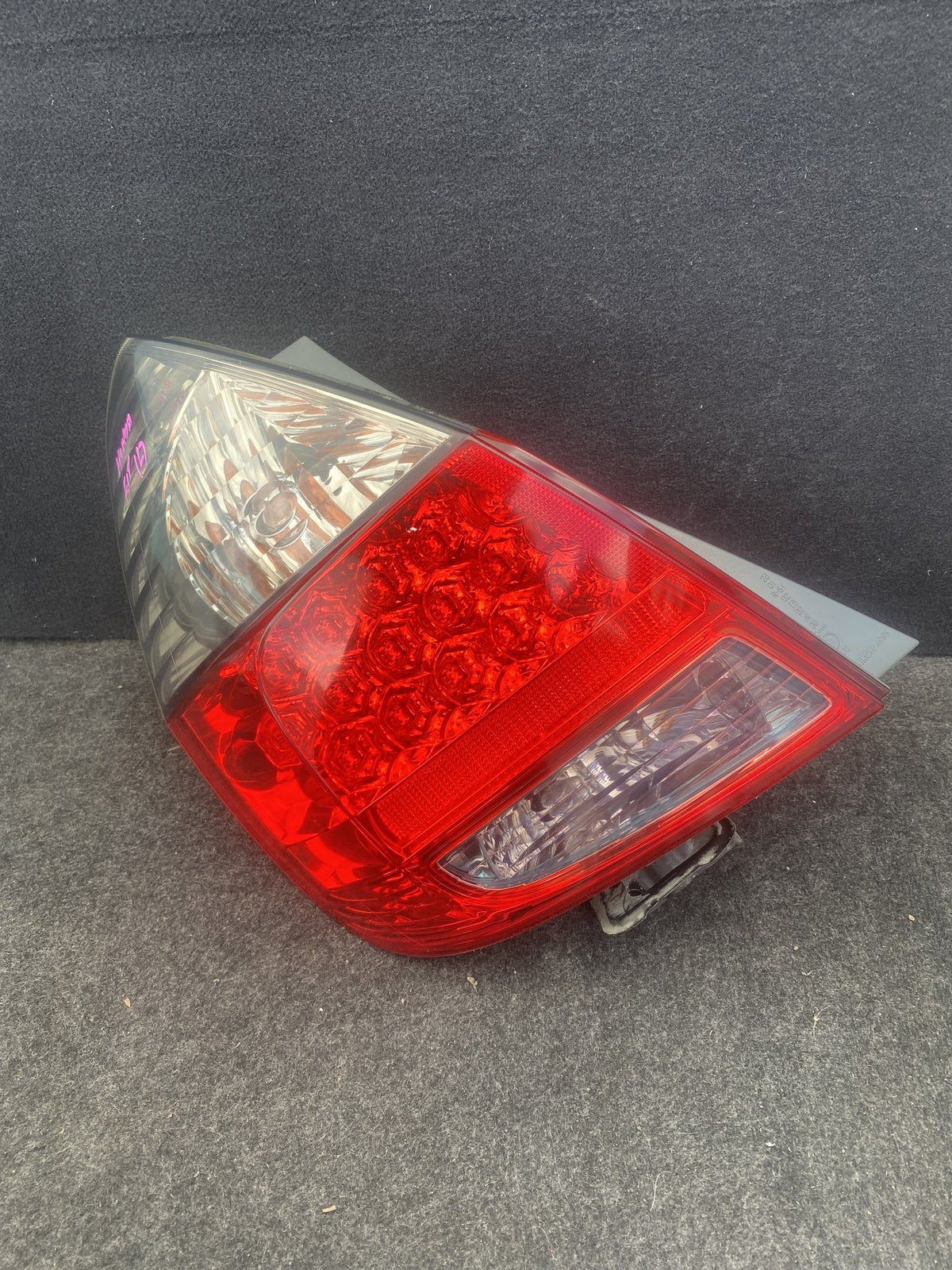 2007 Honda Fit - Left Taillight PN: HASDAMAGEDLUGUNDERNEATHSEEPICS