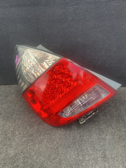 2007 Honda Fit - Left Taillight PN: HASDAMAGEDLUGUNDERNEATHSEEPICS