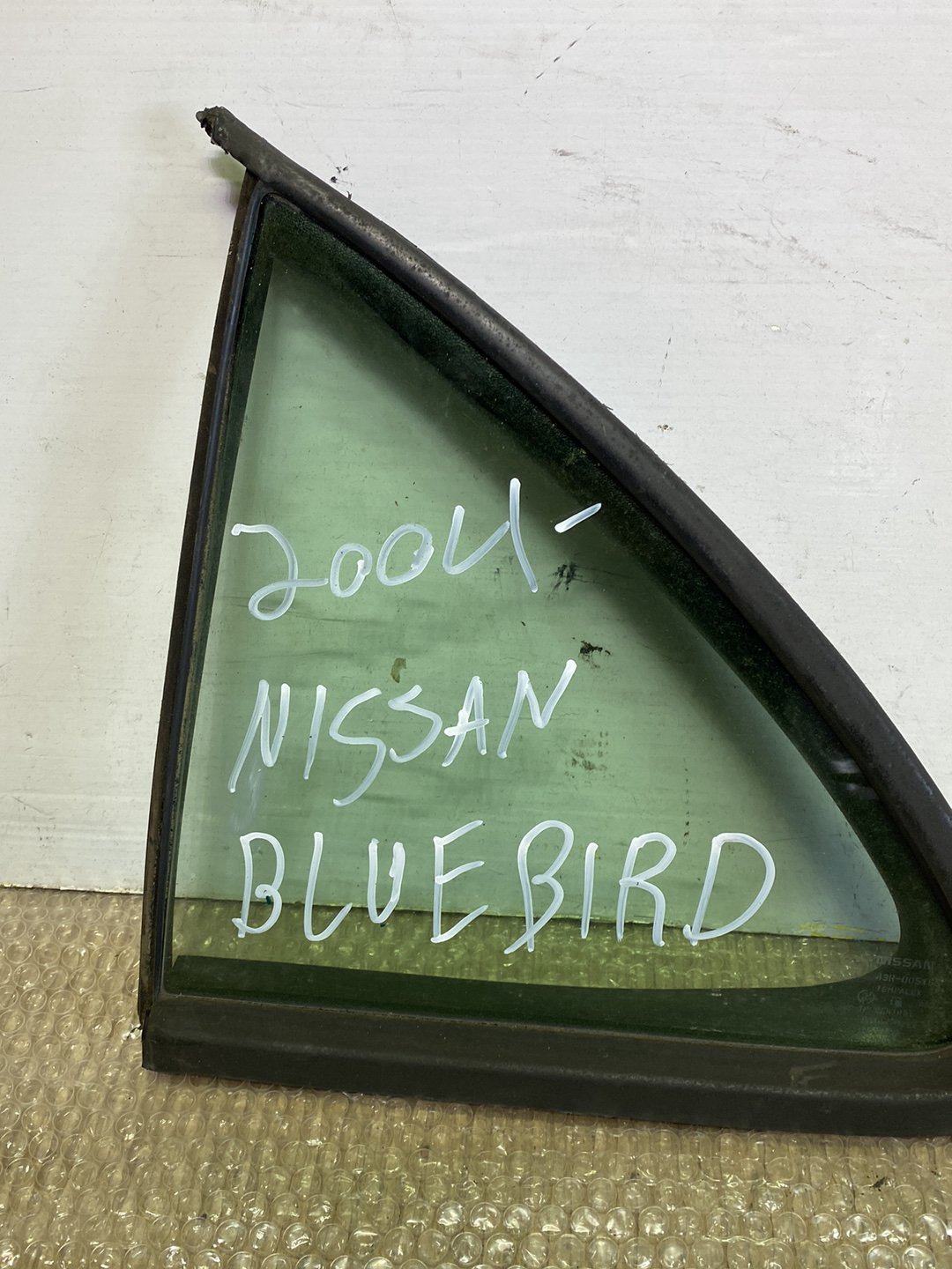 2004 Nissan Bluebird- Left Rear Quarter Door Glass PN: M2E2