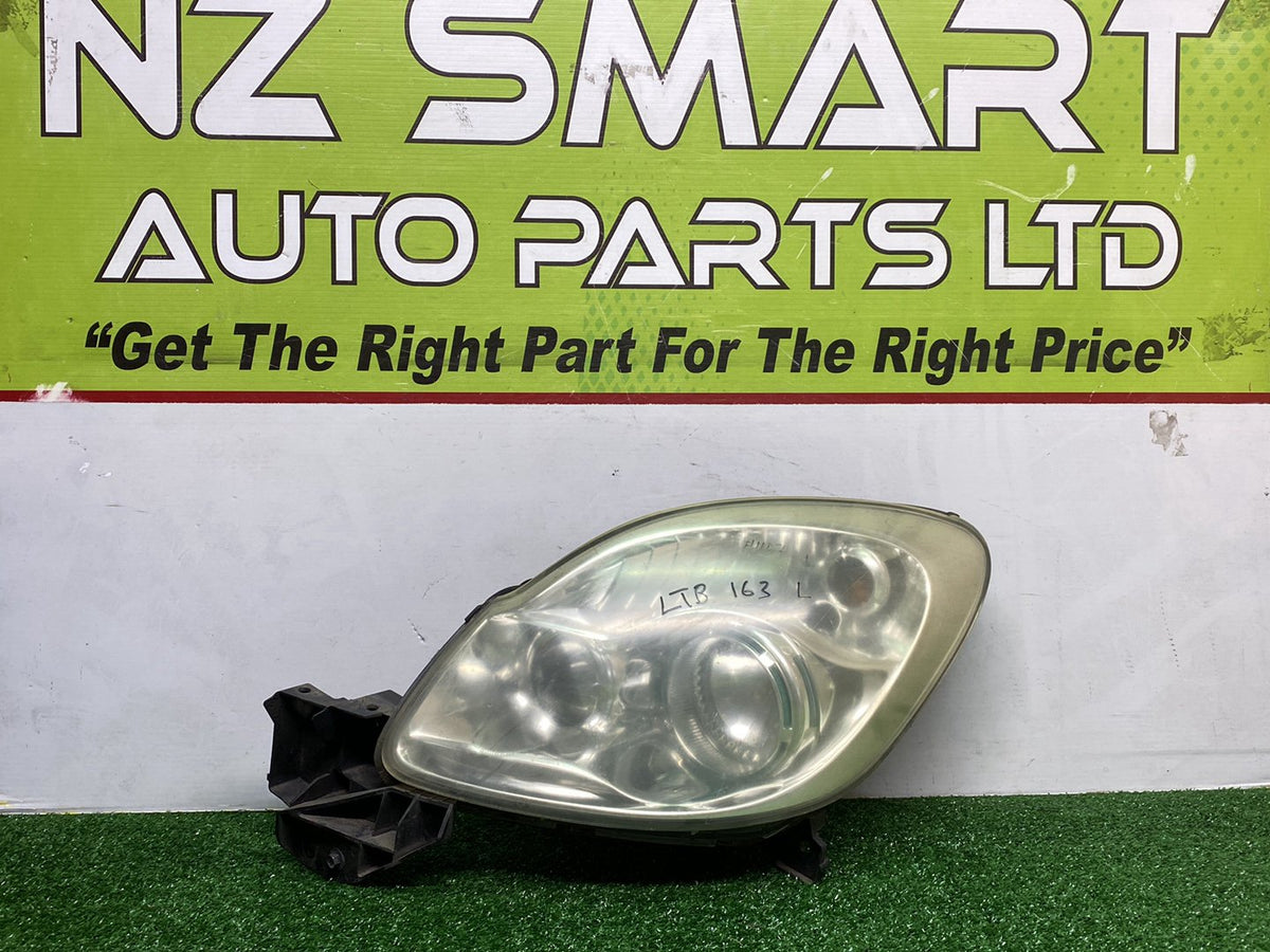 2007 Mazda Verisa - Left Headlight PN: D673510L0