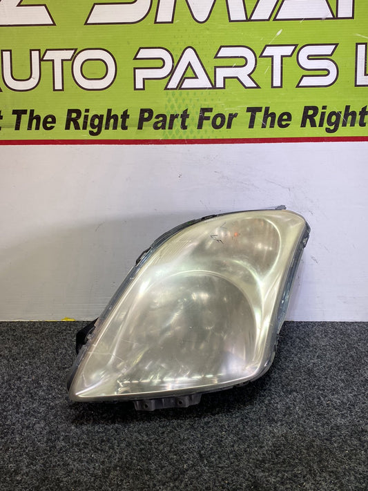 2004 Suzuki Swift - Left Headlight PN: STANLEY P4432L