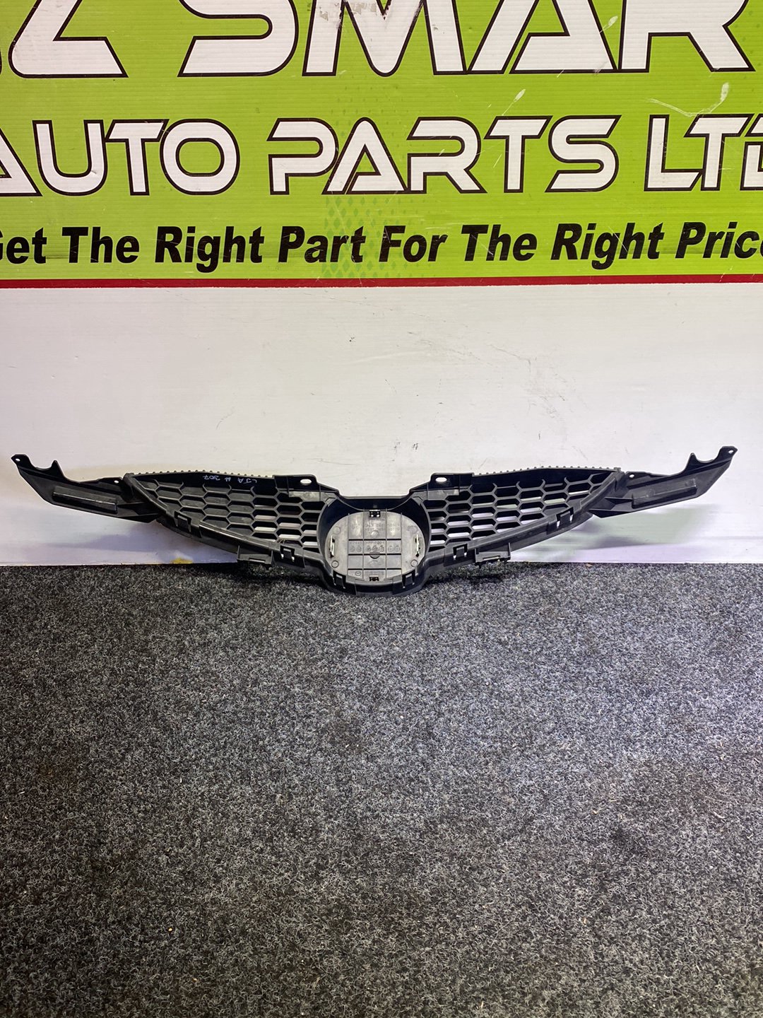 2010 Mazda Demio - Upper Bumper Grille PN: D65150710