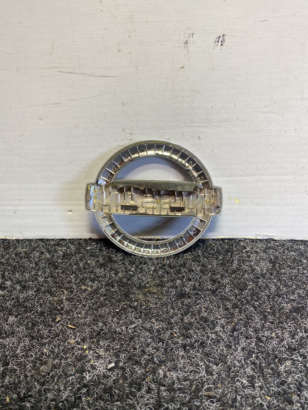 2012 Nissan March - Bumper Grille Badge