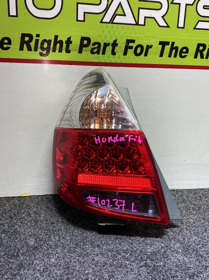 2005 Honda Fit - Left Taillight PN: ICHIKOH 4995