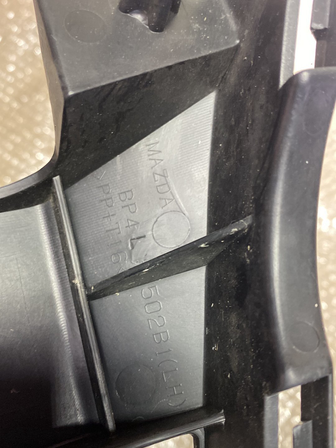 2005 Mazda Axela- Left Front Bumper Retainer PN: 502B1