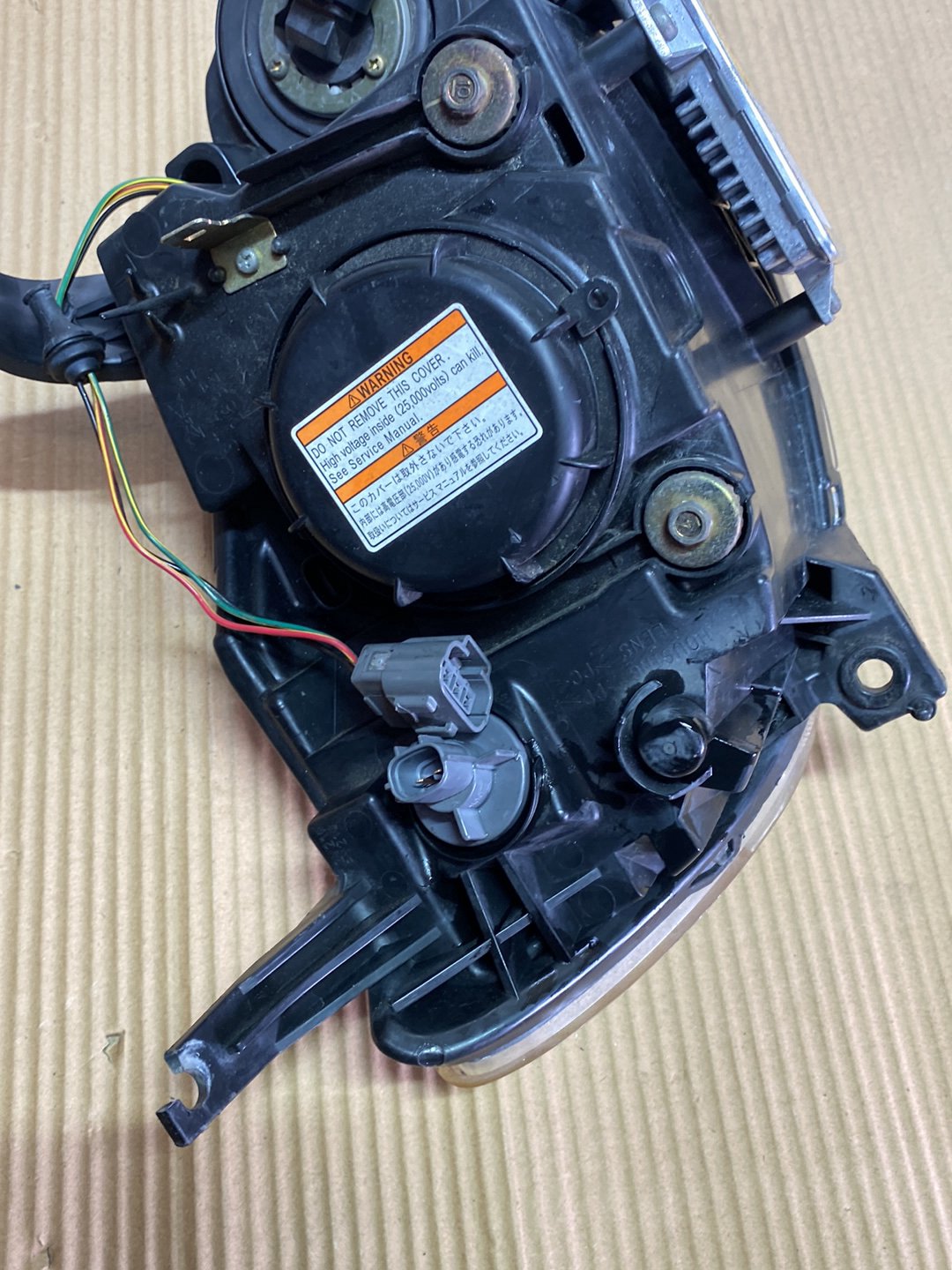 2005 Mazda Demio- Left Headlight PN: STANLEY P2632