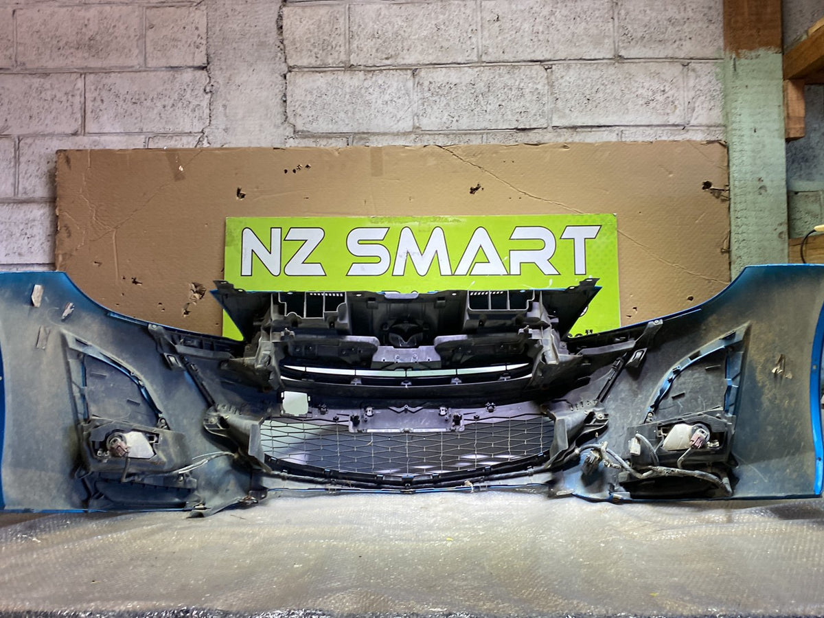 2009 Mazda Axela- Front Bumper PN: see photos
