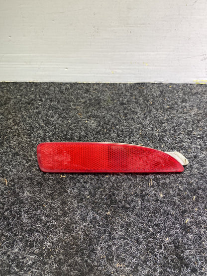 2006 Mazda Axela - Left Rear Bumper Reflector PN: STANLEY P2491 B