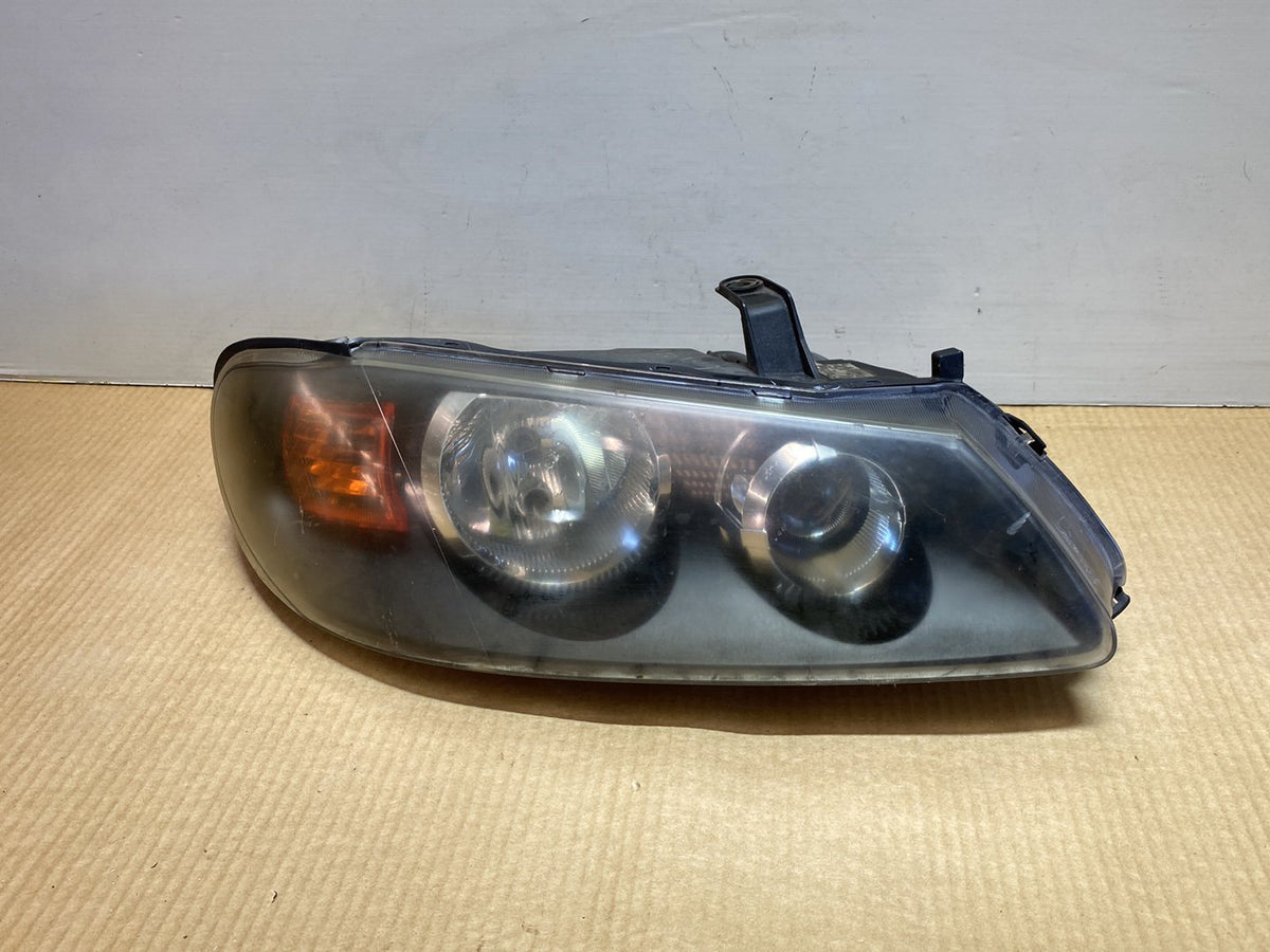 2005 Nissan Pulsar - Right Headlight PN: Koito 100-16390