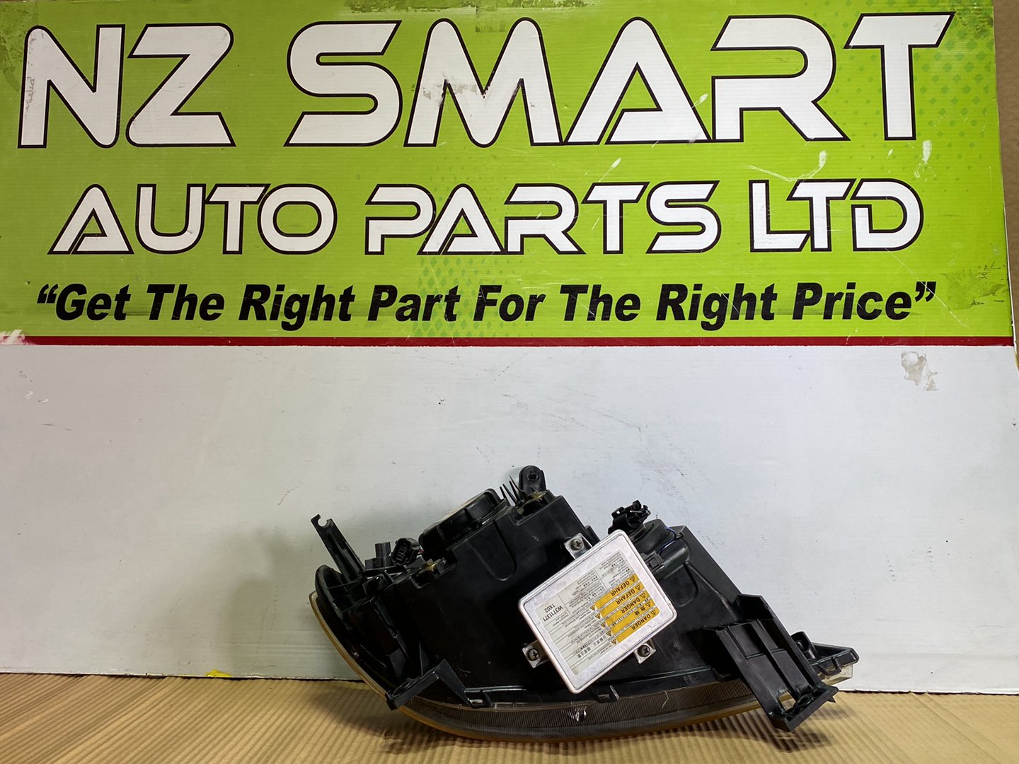 2005 Mazda Demio- Left Headlight PN: STANLEY P2632