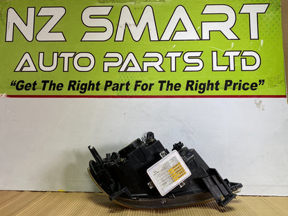 2005 Mazda Demio- Left Headlight PN: STANLEY P2632