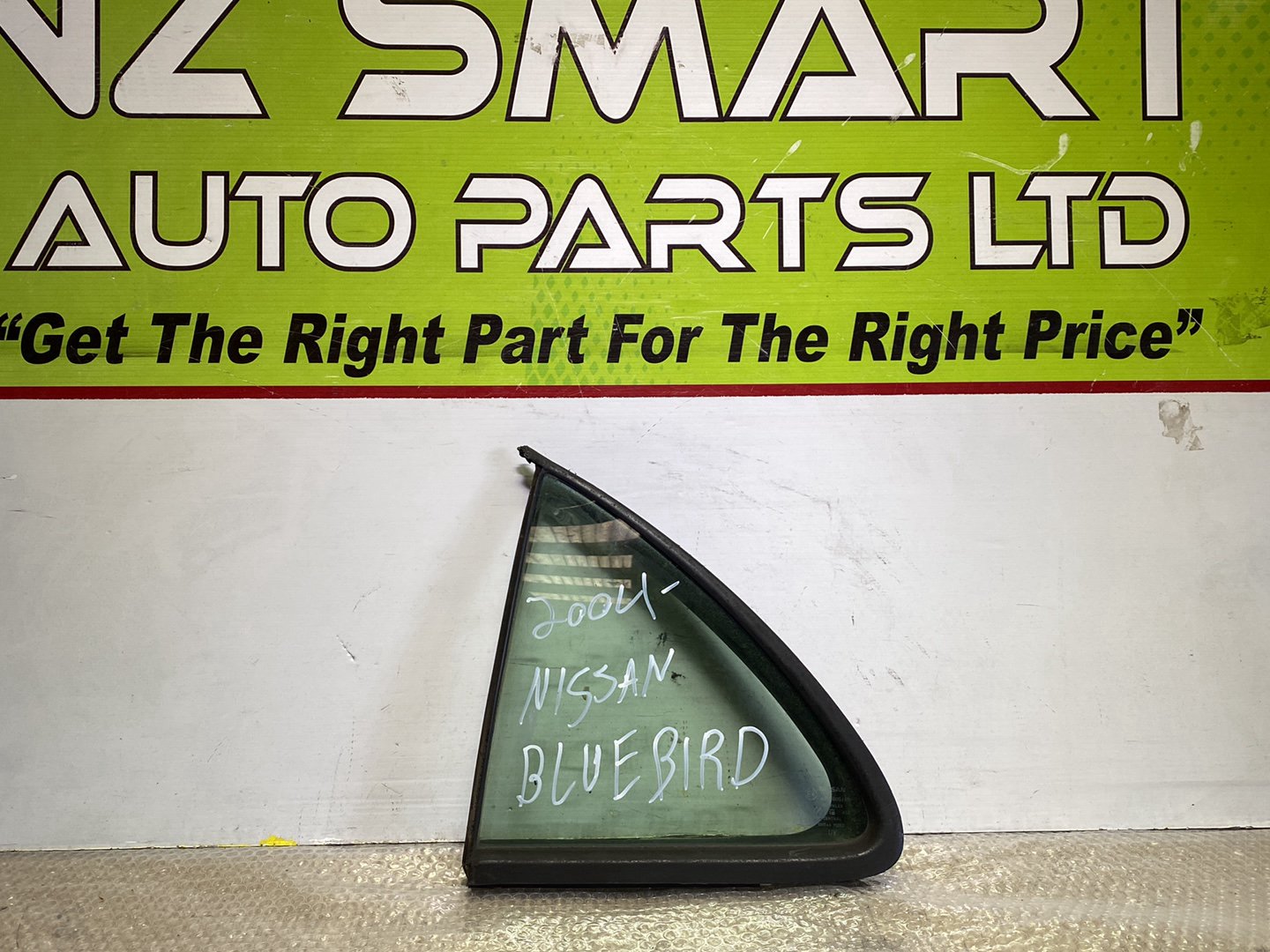 2004 Nissan Bluebird- Left Rear Quarter Door Glass PN: M2E2